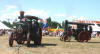 A pair of traction engines going round the ring 