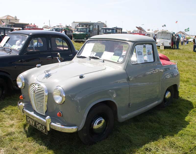 An Austin A30 left and two A35s including an unusual pick up version
