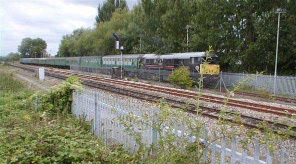 31128 takes the Green Train through Norton Fitzwarren 