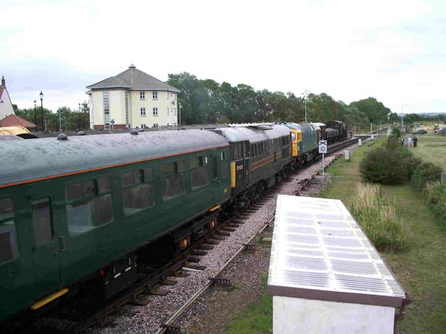 31128 and D6566 leaving Minehead with the Green Train 